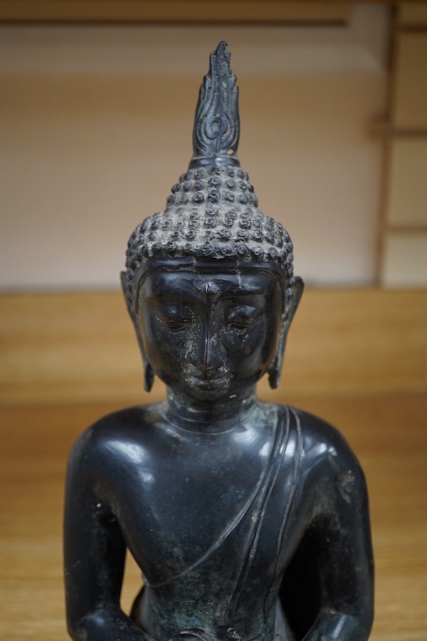 A Thai bronze seated figure of Buddha Shakyamuni, 36cm high. Condition - good